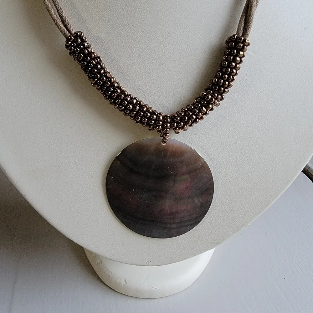 Shell necklace with beadwork and leather rope necklace